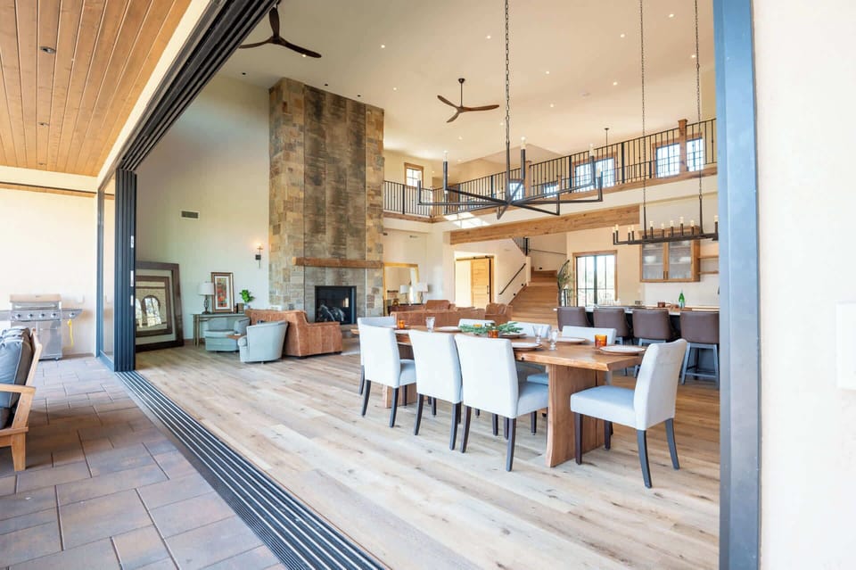 Gather around the elegant dining table with seating for up to 12—perfect for hosting intimate dinners or celebratory meals with a view.