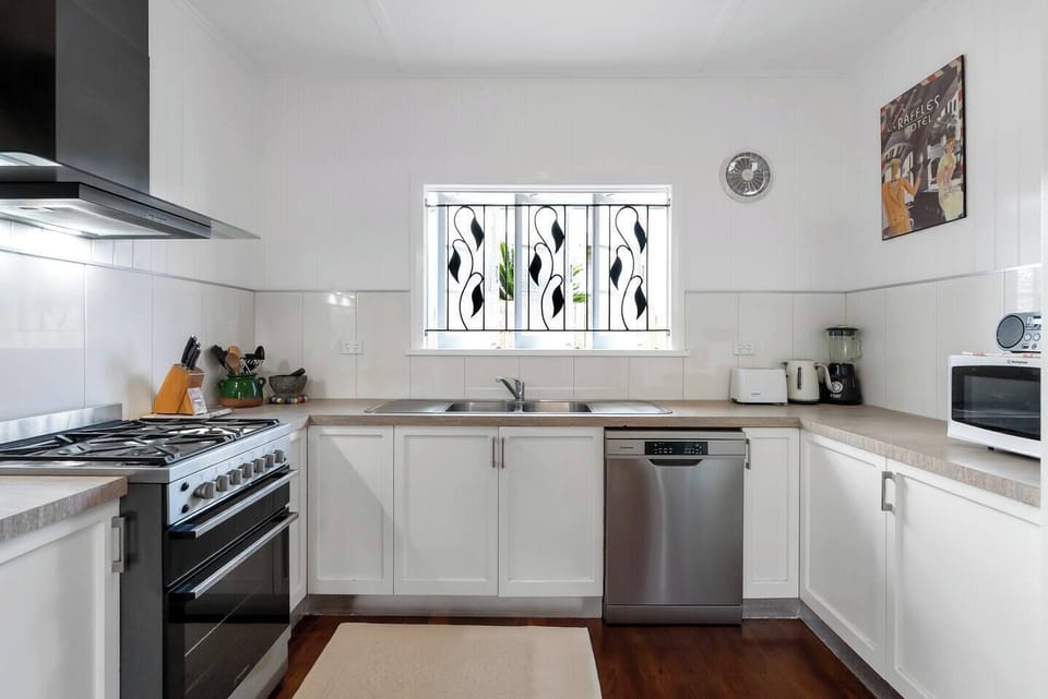 Whip up meals in the modern kitchen, complete with essentials like an oven, dishwasher, and a microwave.