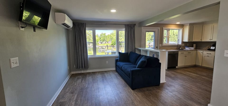 Extra sleeping space with a comfy full sofa bed in the living room.