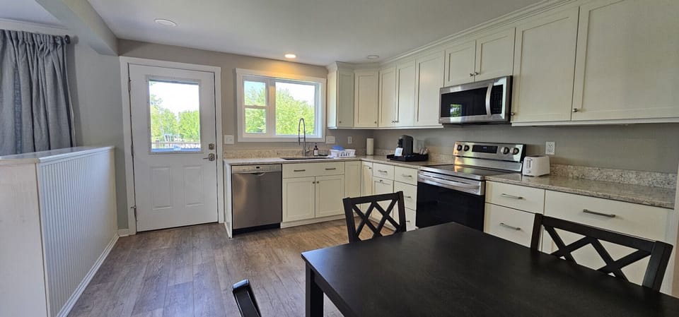 Full kitchen with modern appliances—perfect for family dinners or quick snacks.
