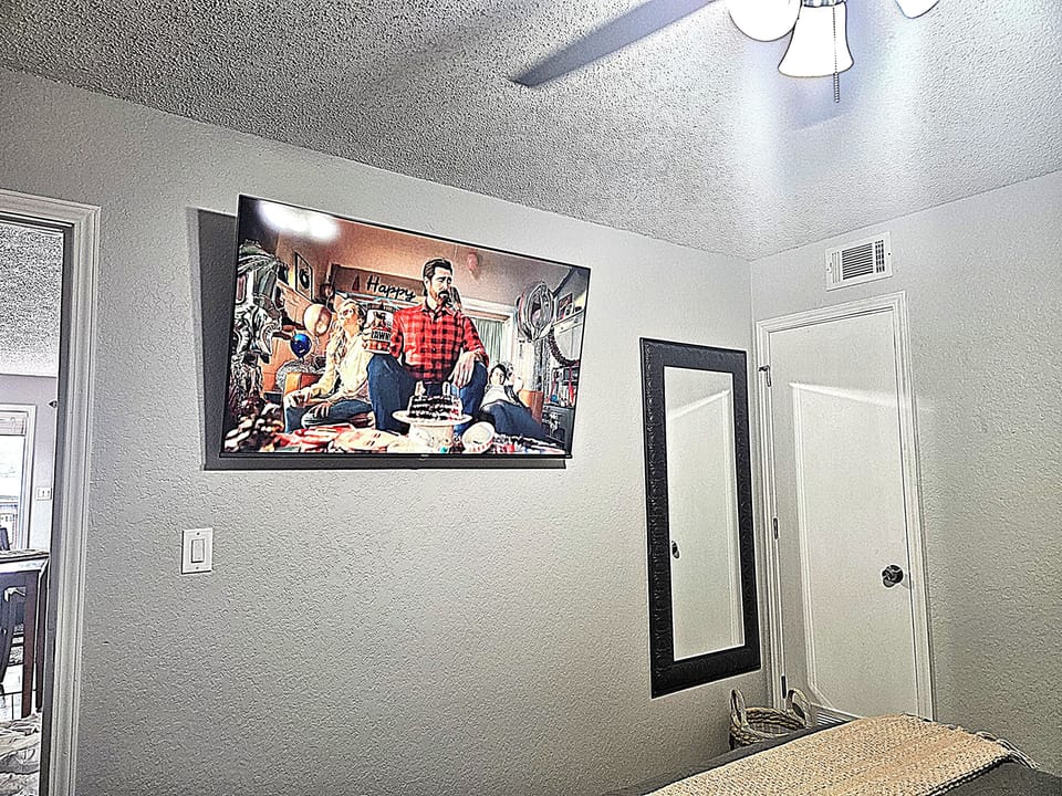 60 Smart TV in bedroom.