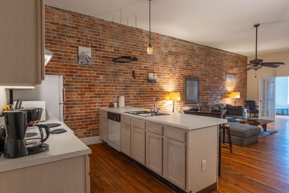 Family Room, beautiful original brick walls!