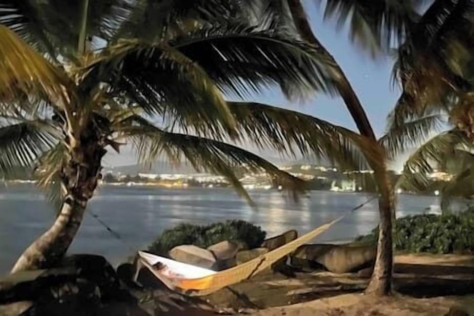 Night view looking across the bay of Las Picüas and in the distance to the left lies Luquillo.  