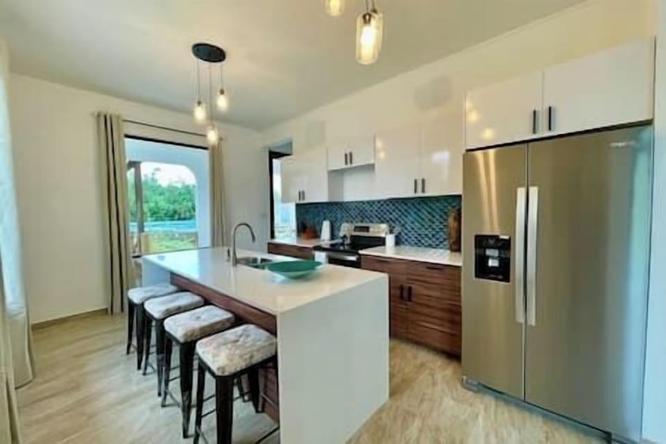 Beach House:  Plenty of room for everyone.  Sit at the island or the dining table for a total of 12. 