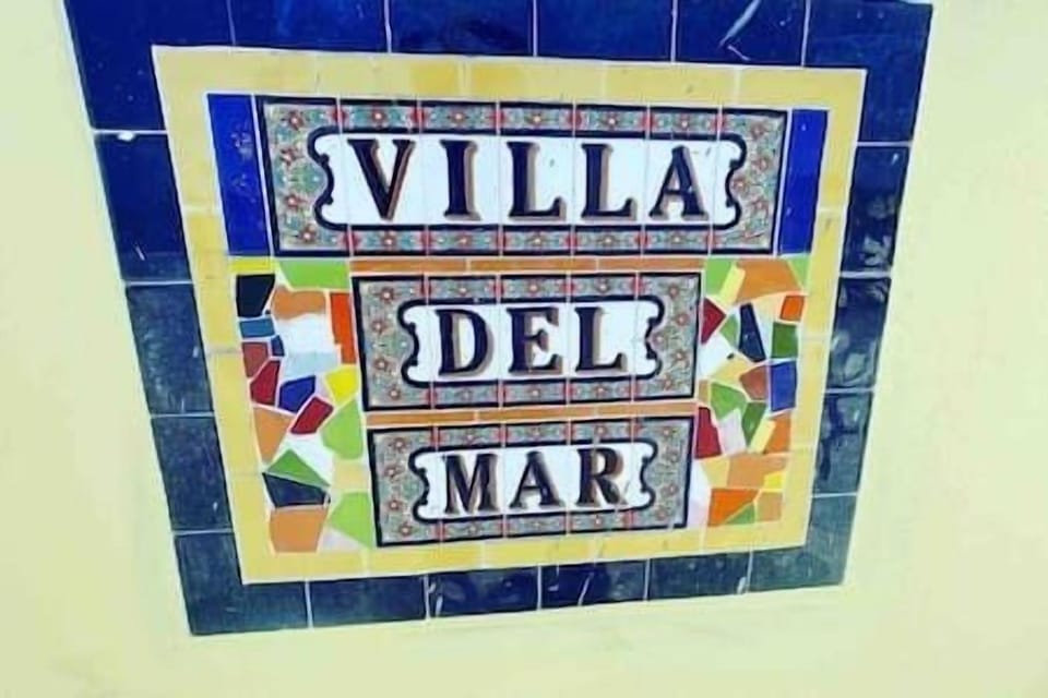 Villa Del Mar Street Sign located on the wall outside the property. 