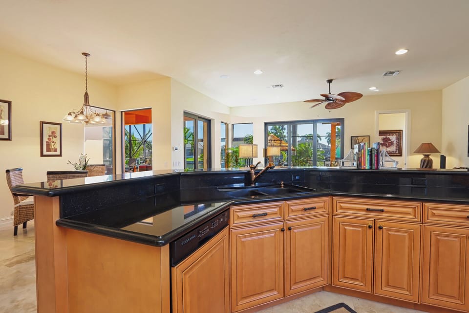 A beautifully designed open-concept kitchen offering generous prep space, modern appliances, and effortless flow into the main living areas
