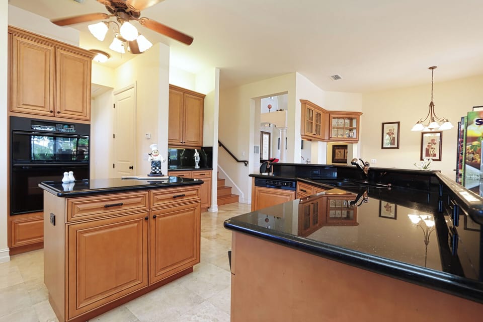 Prepare gourmet meals with ease in the fully equipped chef's kitchen, complete with a generous prep island and ample counter space