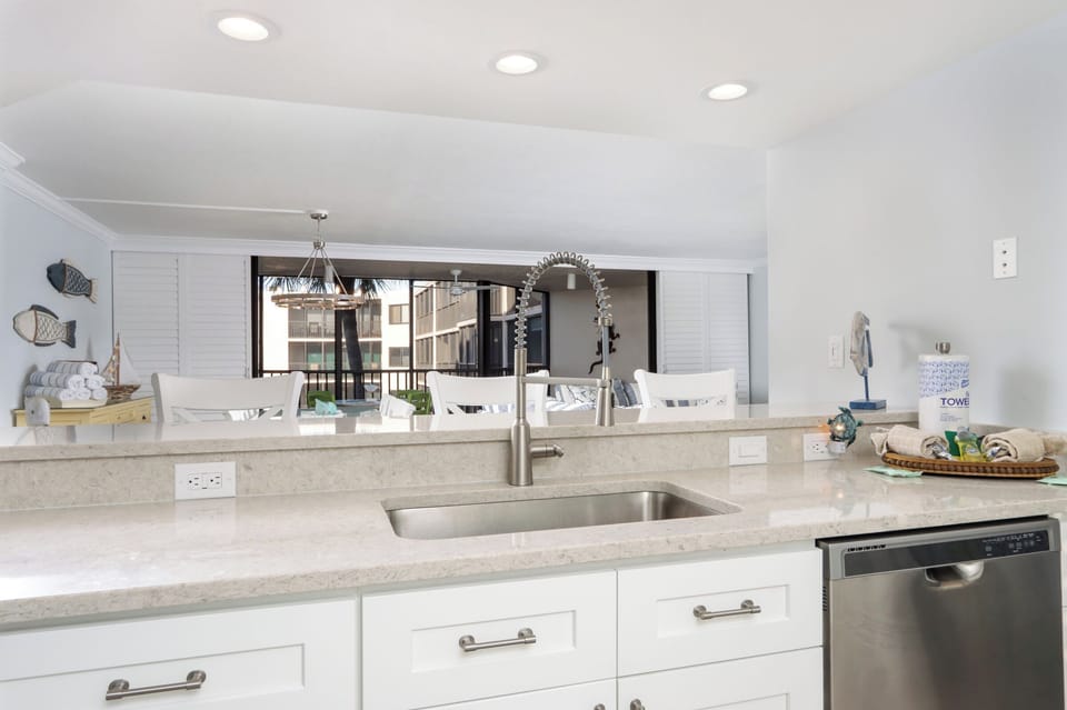Kitchen overlooks dining and living area and provides counter seating