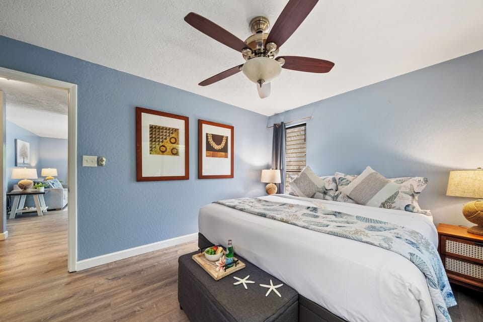 Well-appointed bedroom with king bed and decorative touches.