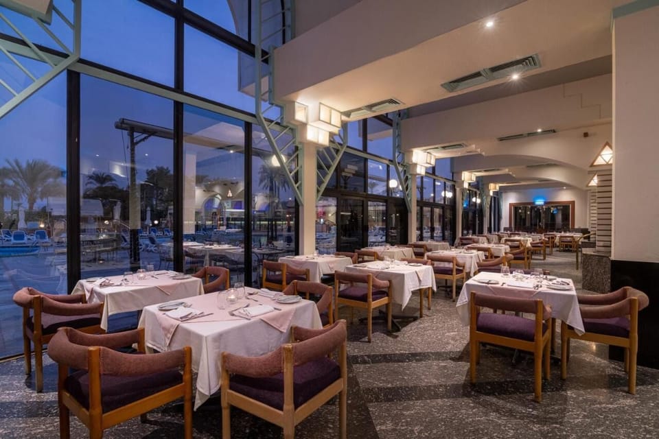 Savor candlelit dinners in an airy restaurant with poolside views