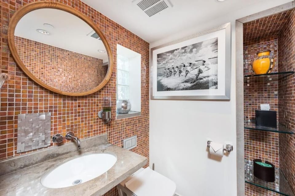 Get ready with ease at the modern vanity and statement mirror.