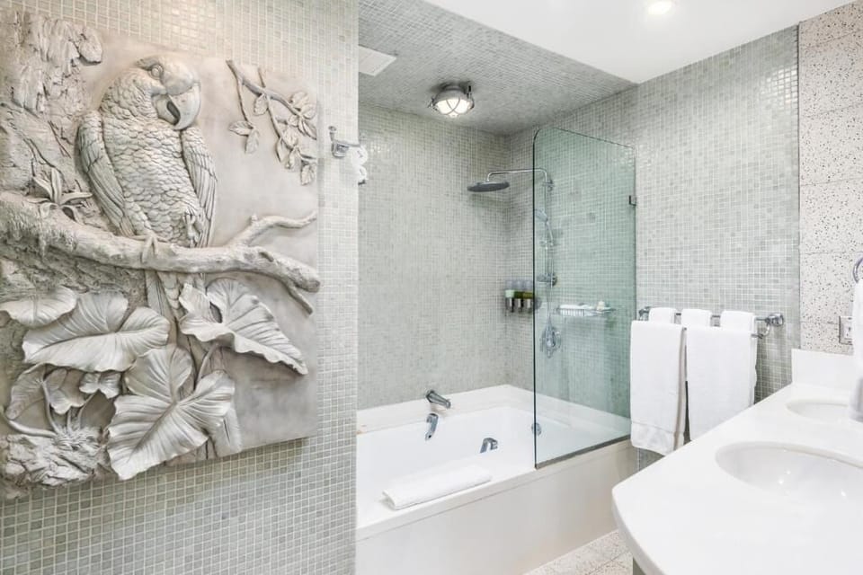 Soak and recharge in a bright bath with rainfall shower.