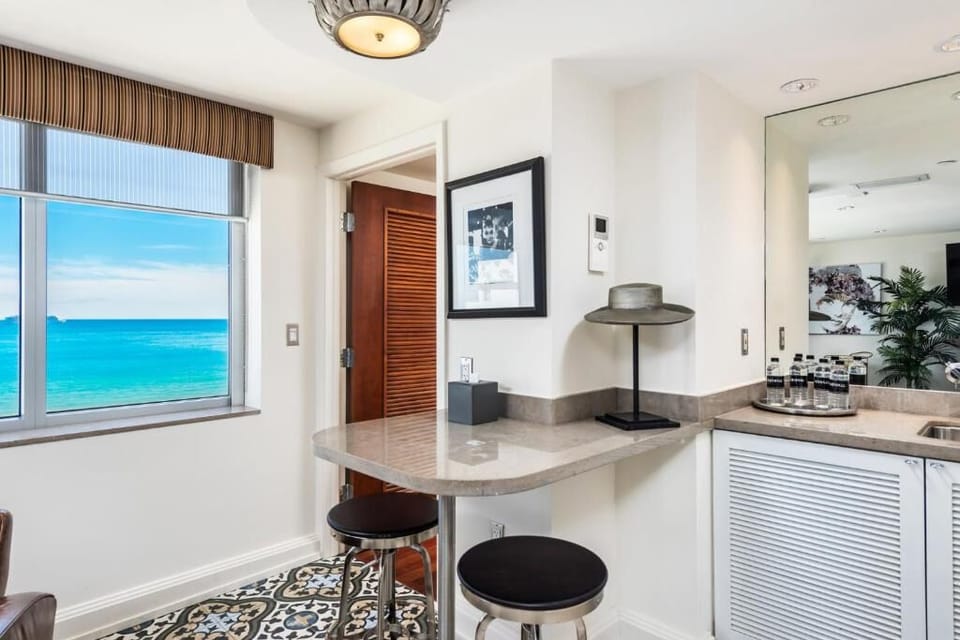 Sip morning coffee at the bar with sparkling ocean views.