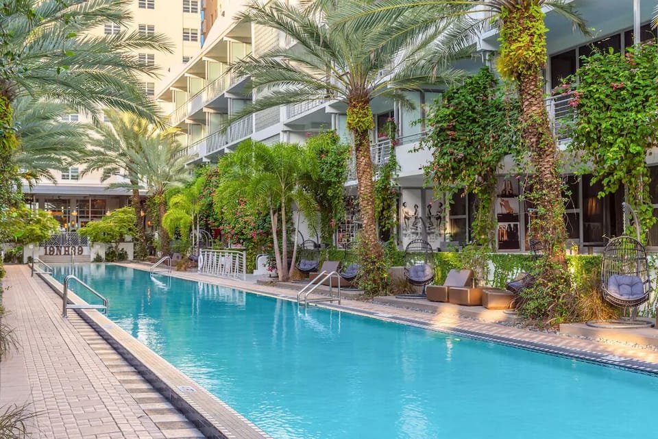 Lounge poolside in the shade, steps from your swim.