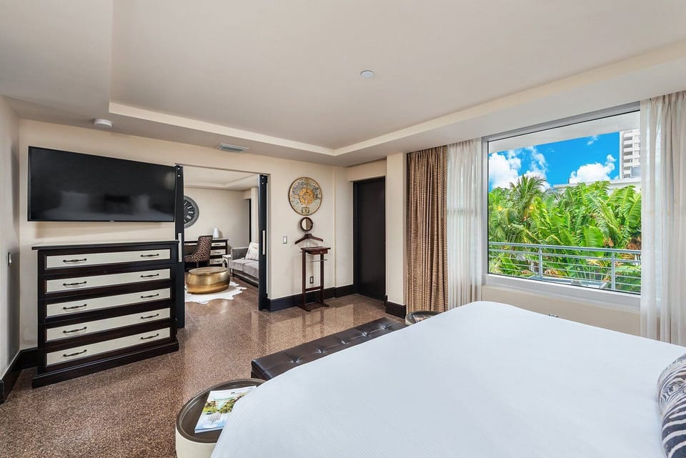Wake up to sunshine and palm views from bed.