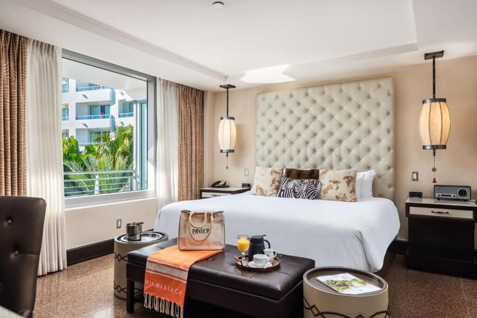 Settle into a luxurious king bed with airy, sunlit vibes.