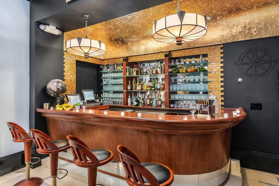 Sip handcrafted drinks at the gleaming, vintage-inspired cocktail bar.