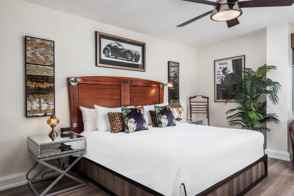 Relax into luxe pillows and a statement wood headboard.