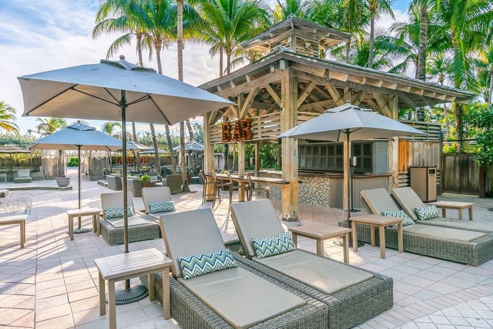 Recharge on cushioned loungers steps from the open-air bar.