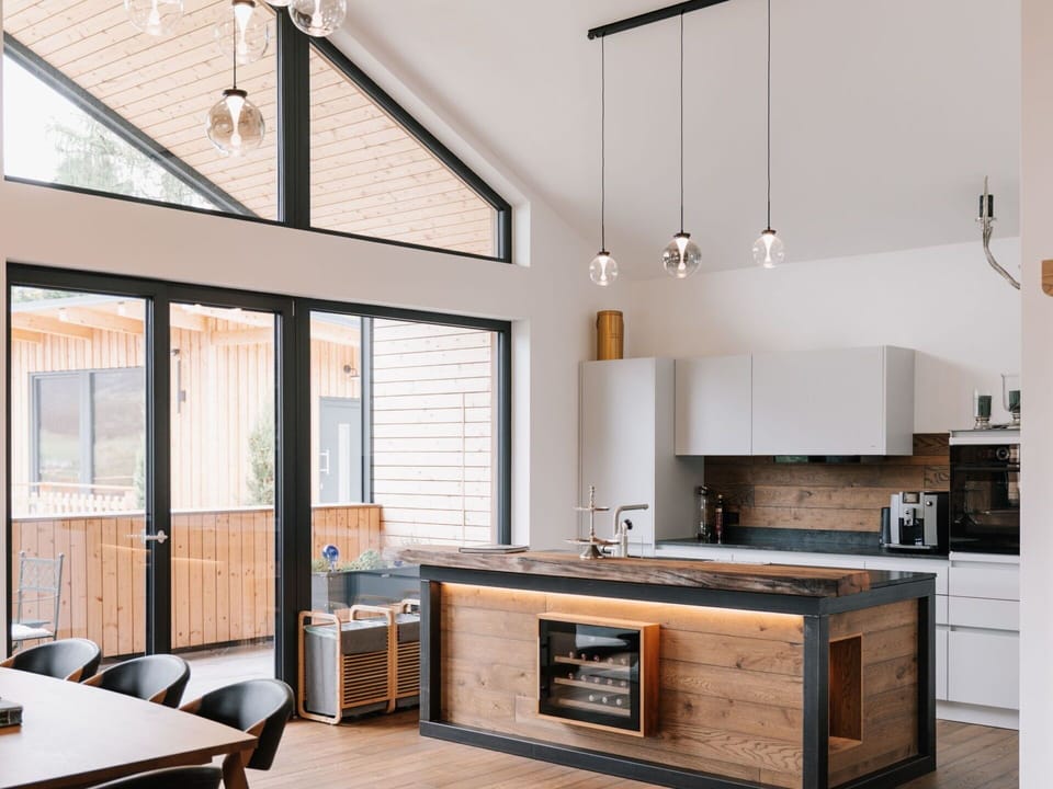 Furniture, Kitchen, Interior Design, Flooring, Countertop, Wood, Floor, Ceiling, Light Fixture, Cabinetry