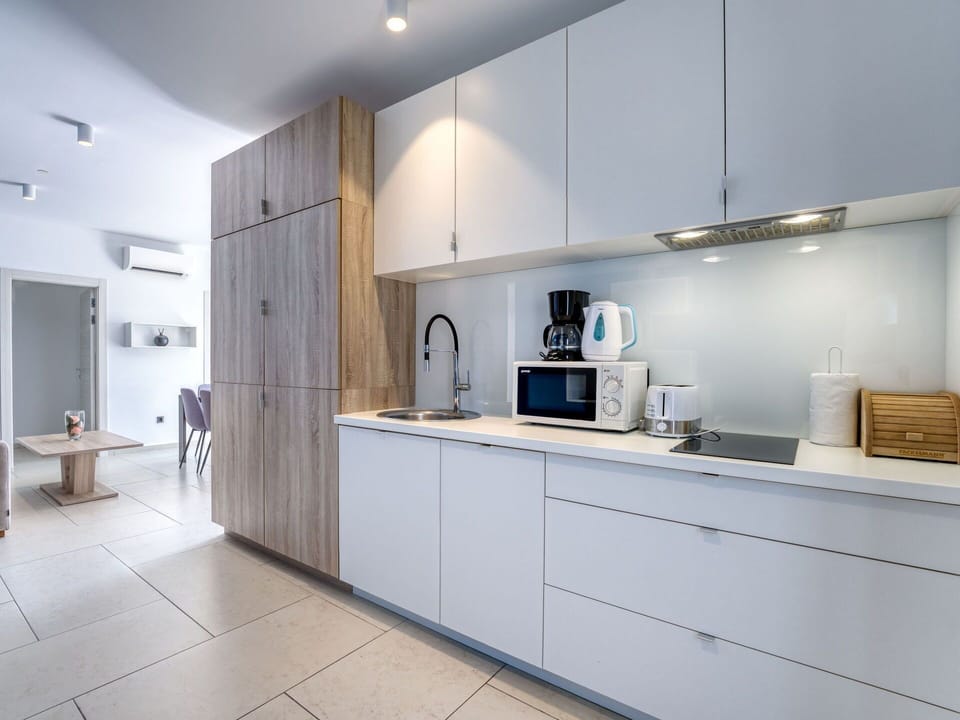Kitchen, Countertop, Cabinetry, Interior Design, Kitchen Appliance, Flooring, Furniture, Wood, Major Appliance, Floor