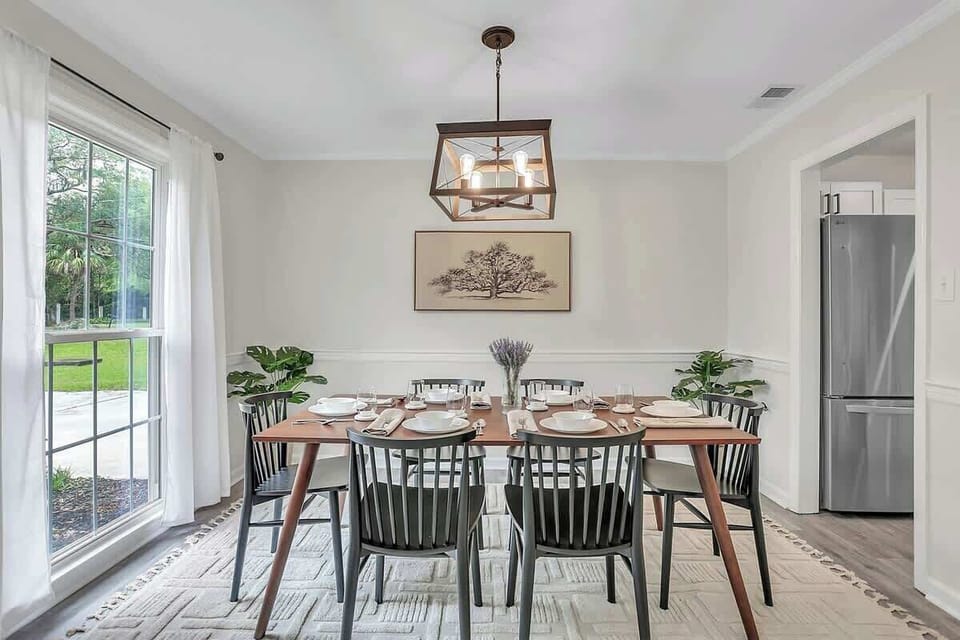 With a natural light-filled dining room, this table is the perfect spot to plan your next day's adventures and gather for meals. An uncluttered design amplifies the inviting nature of this room. 