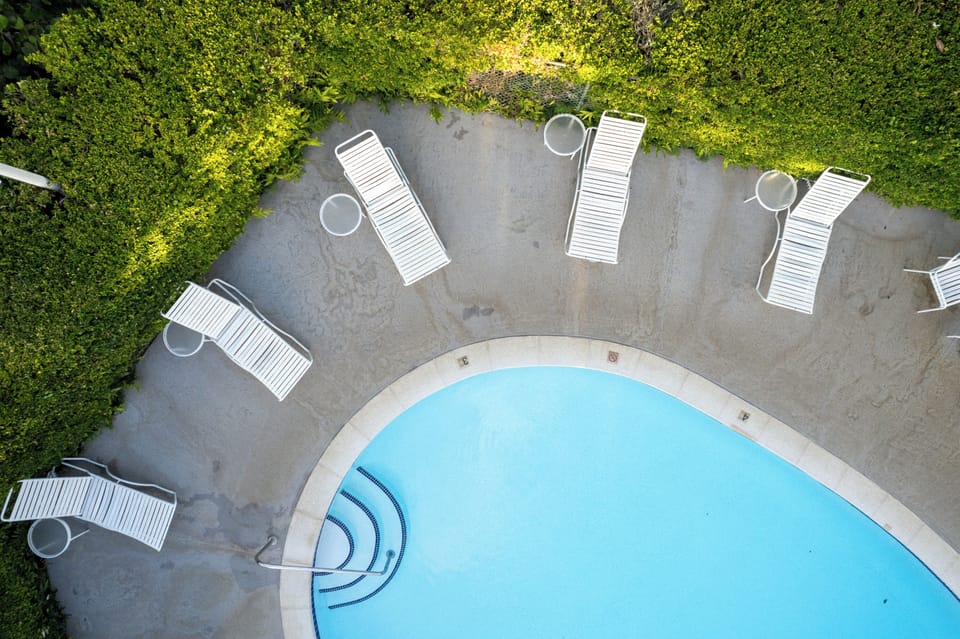 Stretch out on sun loungers just steps from the water.