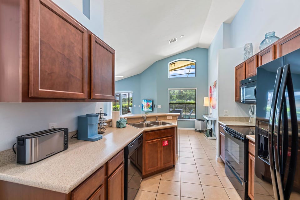 A spacious kitchen layout providing room for multiple guests to cook together.