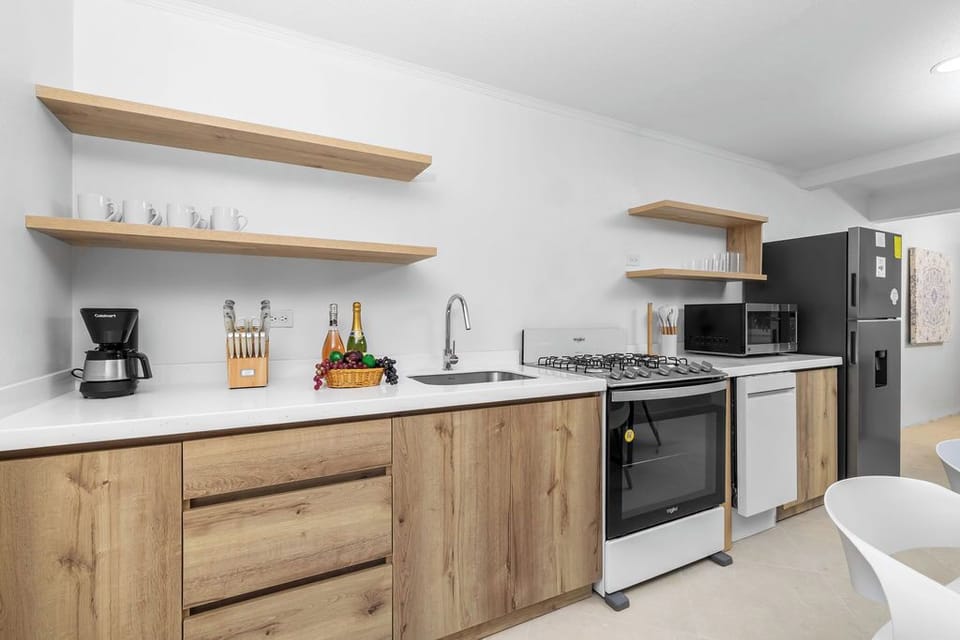 Cook, dine, and gather with ease in our fully equipped kitchen – featuring modern appliances, ample space, and everything you need to feel right at home.