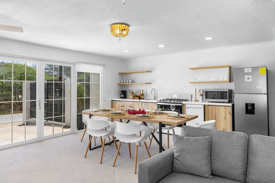 Experience seamless luxury in our open-concept space – where the elegant dining area, stylish living room, and fully equipped kitchen come together to create the perfect setting for relaxing, entertaining, and making unforgettable memories.