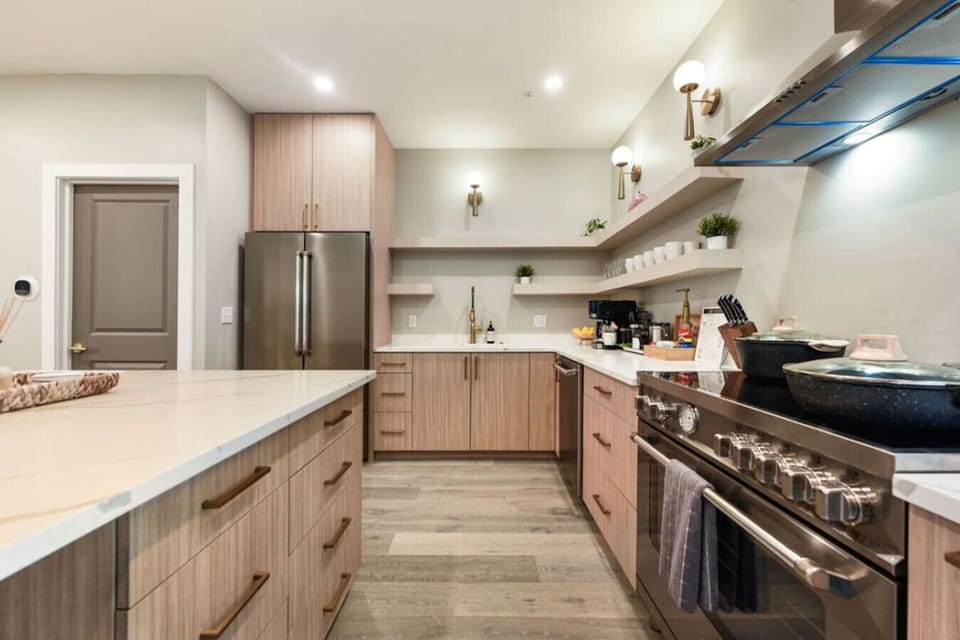 Prepare gourmet meals in the fully equipped, sleek, and modern kitchen.