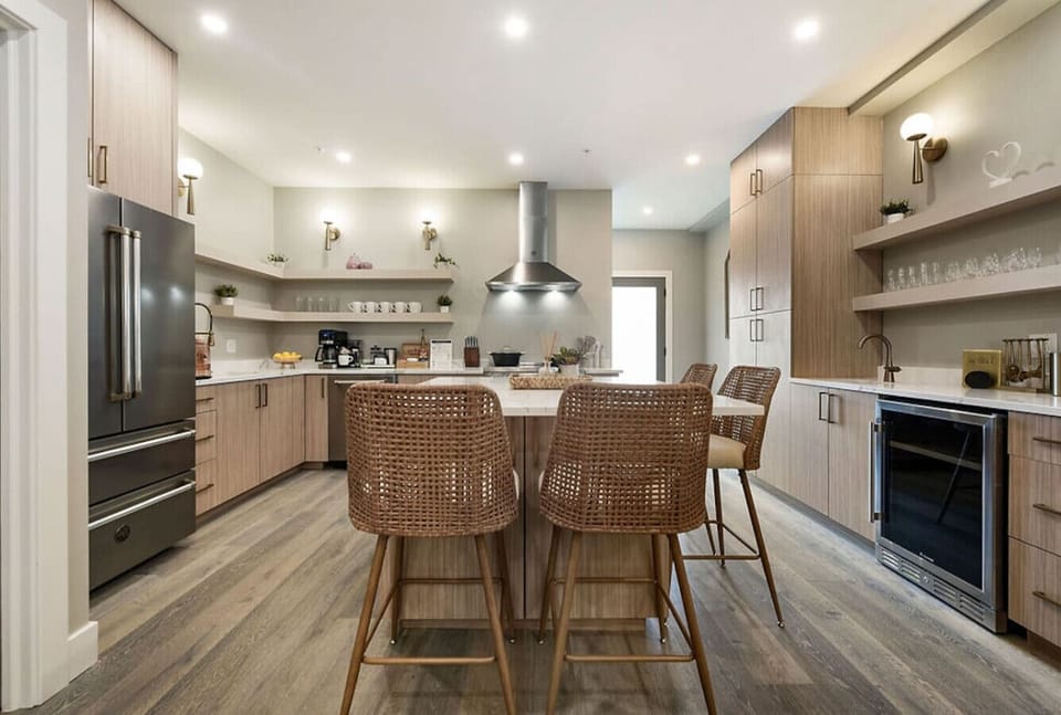 Modern, fully stocked kitchen with a large island and seating for culinary adventures.