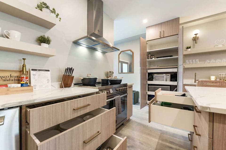 Cook with ease in the fully equipped kitchen, featuring high-end appliances.