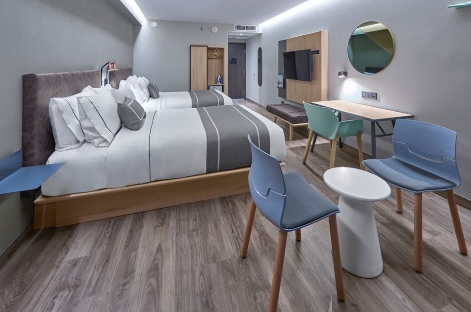 Gather comfortably in a roomy twin setup with cozy seating.