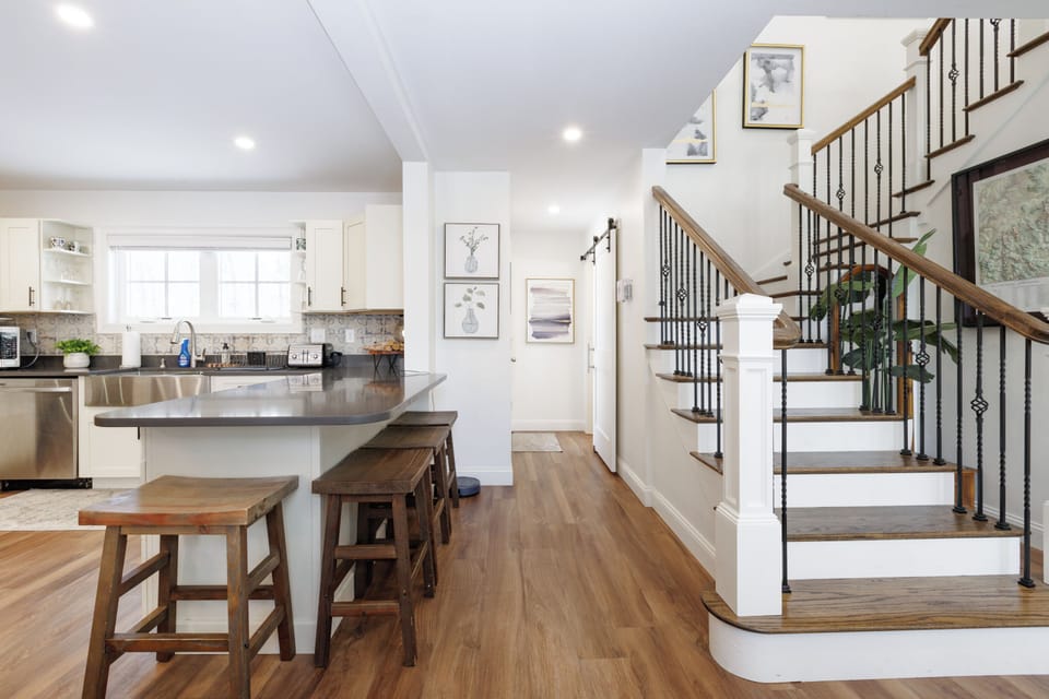 Stairs go up to 4 bedrooms and two full baths