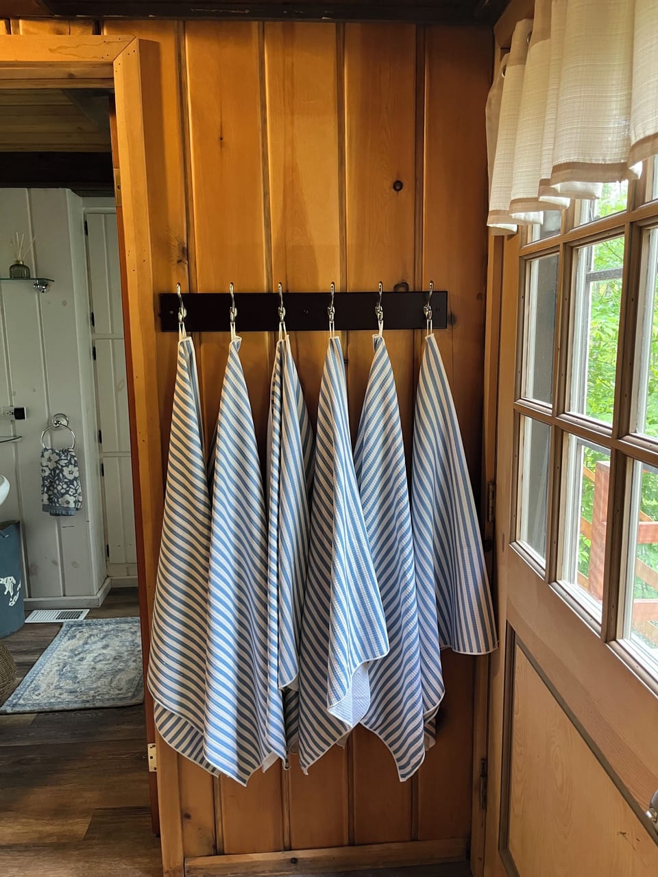 Towels for hot tub, ready by the door leading to the deck
