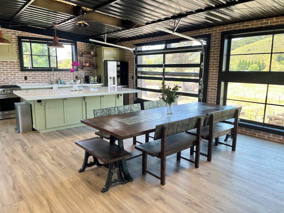 Dining table and open kitchen area.