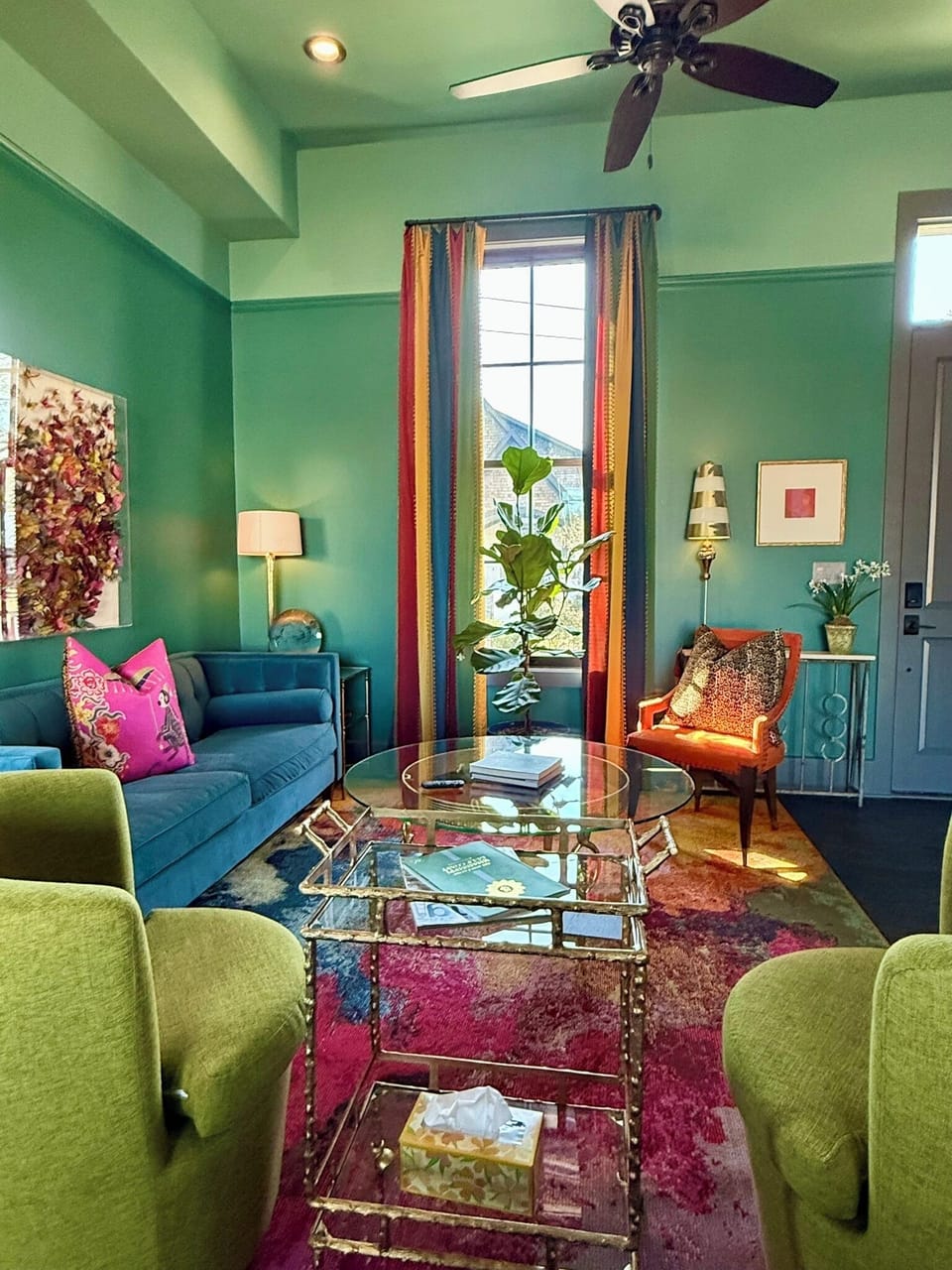 Spacious living room with 12-ft ceilings and abundant natural light.