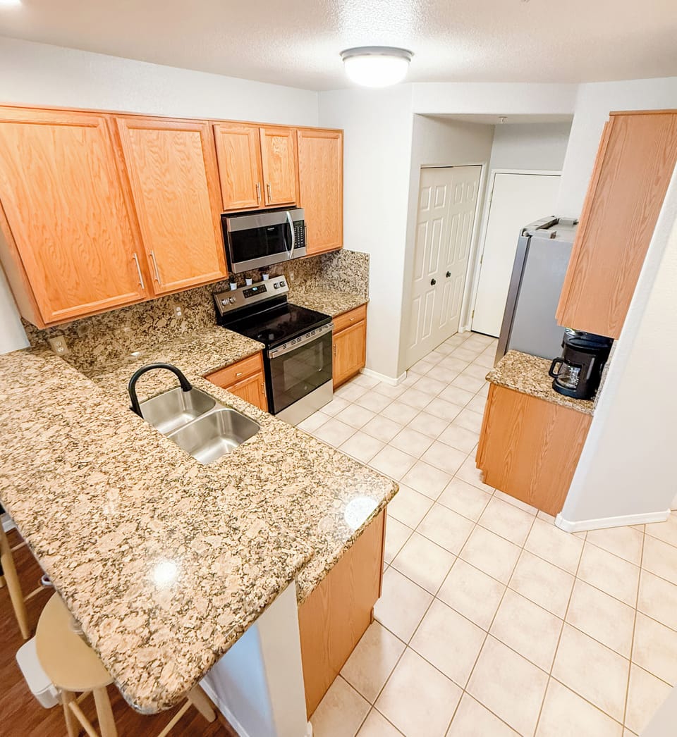 Full kitchen with dishwasher, microwave, coffee maker and everything you need. 