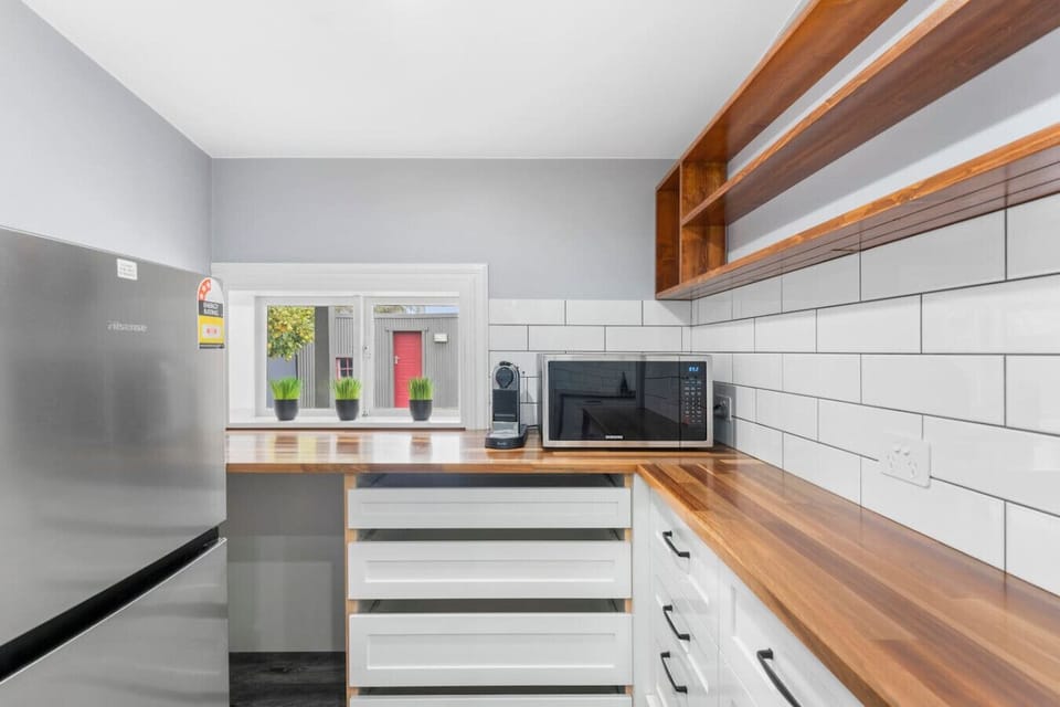 Kitchen Enjoy cooking at home in the fully equipped kitchen featuring modern appliances, ample bench space, a dishwasher, and everything needed to prepare meals with ease.