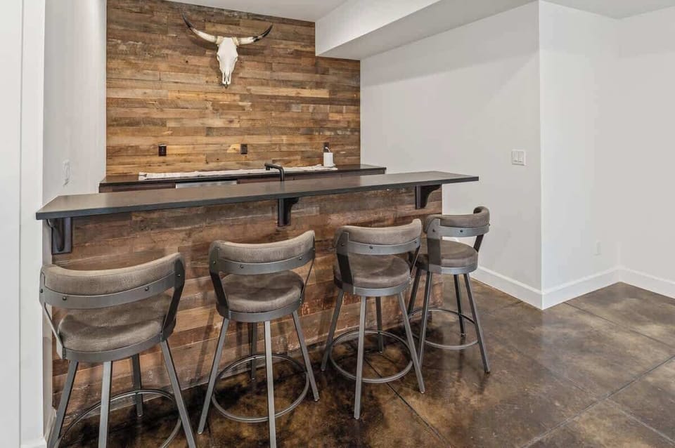 Downstairs bar with a mini fridge
