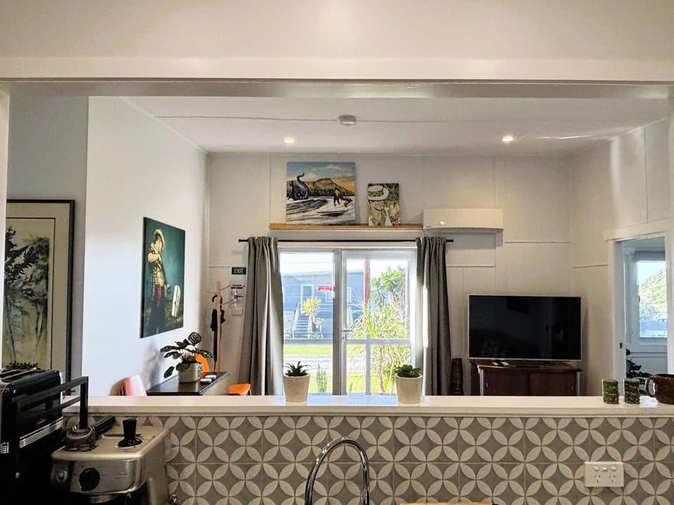 Large cut-out to the living area, keeping the Kitchen space bright and social 