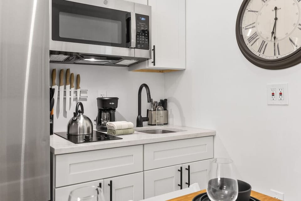 Make your own coffee, tea, or quick meals in our efficient small kitchen, equipped with a coffee maker, kettle, and microwave.