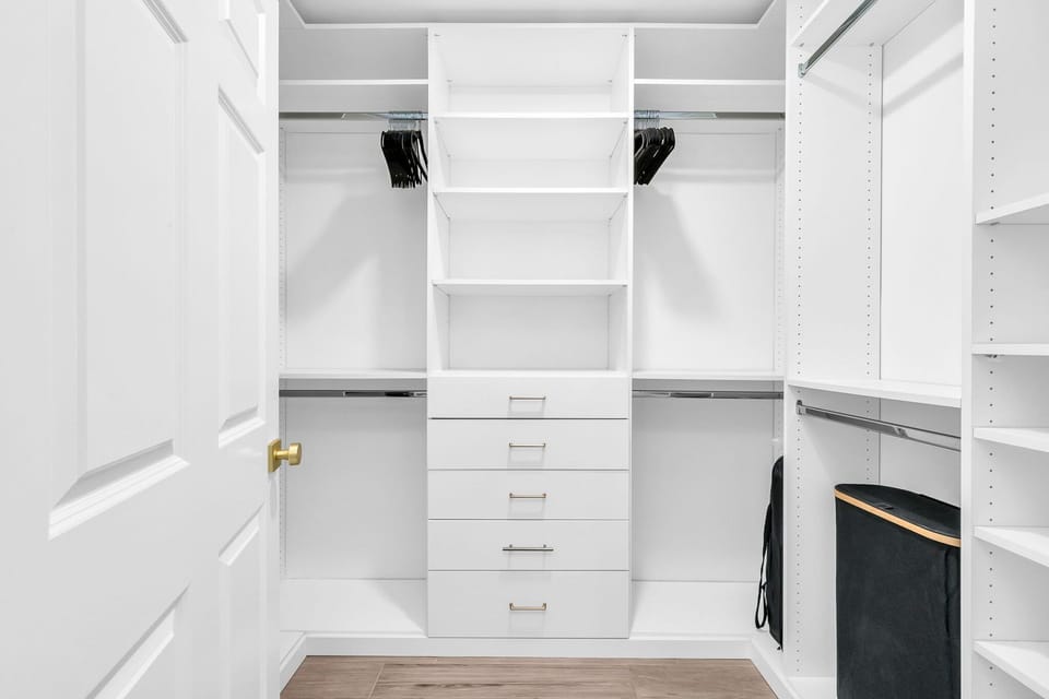 Primary suite walk-in custom California Closets