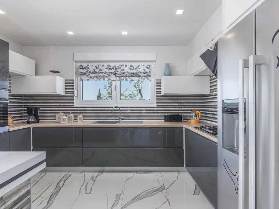 Kitchen, Countertop, Interior Design, Kitchen Appliance, Cabinetry, Flooring, Furniture, Wood, Major Appliance, Home