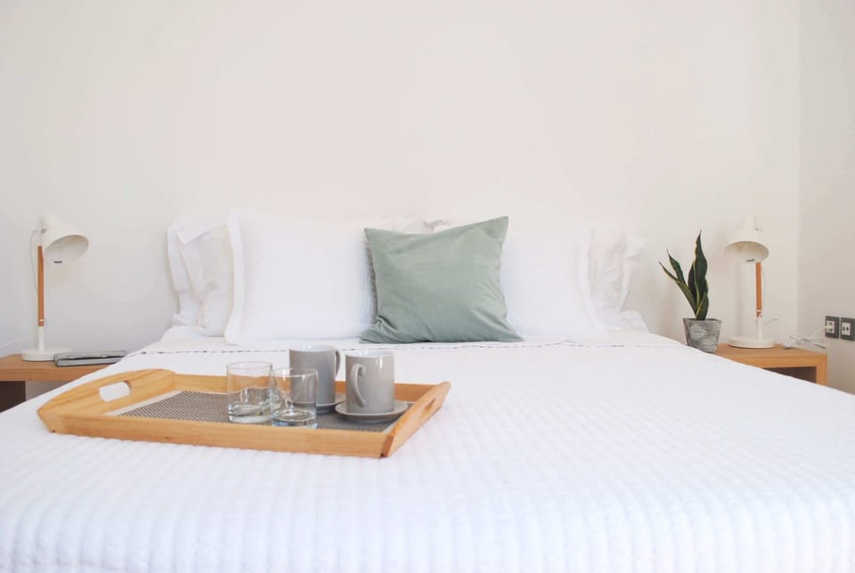 Bright Room View with Wall Art and Wooden Flooring


