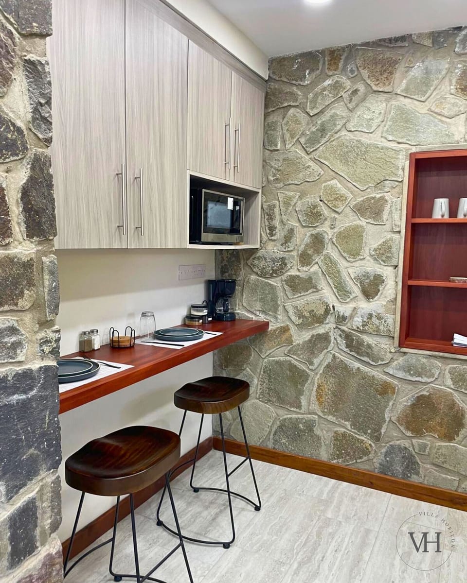 Kitchen features a cozy dining area for two.