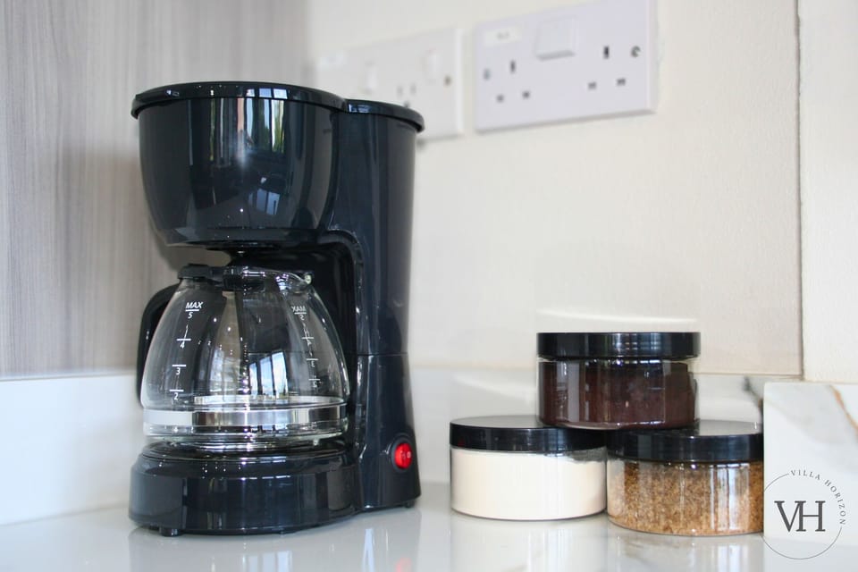 Enjoy our complimentary coffee station, stocked with grounds, sugar, and creamer.