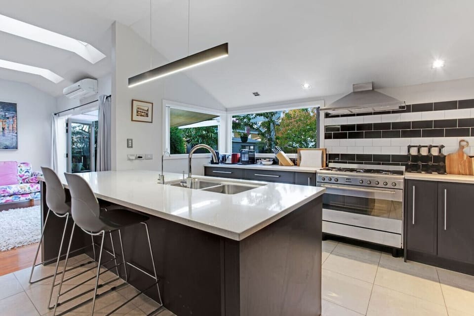 The kitchen has a gas cooktop, oven, microwave, dishwasher and fridge/freezer.