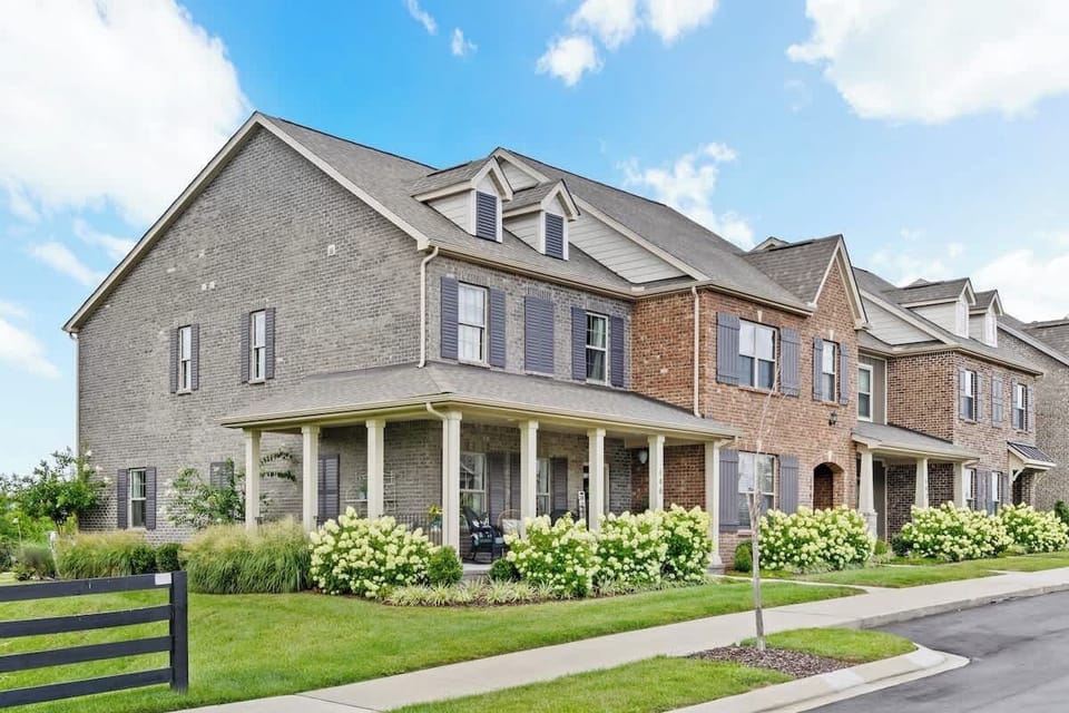 Exterior Charm: Step into a welcoming escape surrounded by vibrant landscaping and modern design!